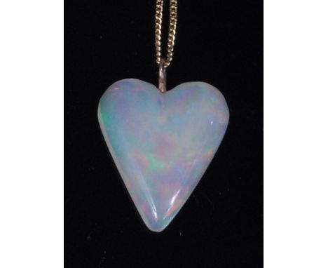 An opal pendant, the polished heart shaped pendant measuring approx 21x20x4mm, on 14ct gold finelink neck chain