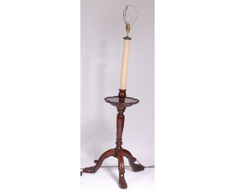 A mahogany lamp standard, in the style of a Georgian kettle stand, with carved lion paw feet, h.120cm (excluding fittings)