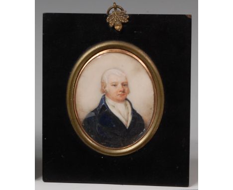 An early 19th century mourning jewel, the obverse as an English school portrait miniature of a gentleman wearing blue tunic a