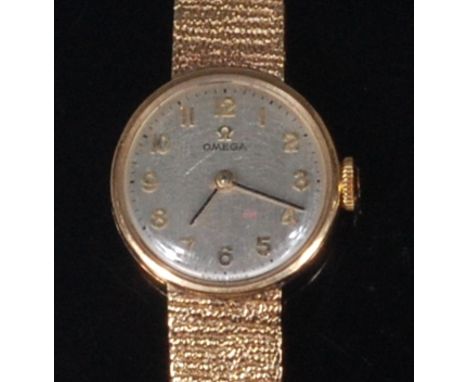 A ladies Omega 9ct gold cased bracelet watch, having signed silvered dial, manual wind movement and textured link bracelet, g