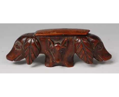 A 19th century treen novelty snuff-box, carved as double-ended hounds heads, the centres each carved with a fox mask, hinged 