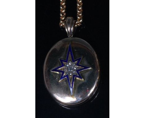 A late Victorian yellow metal, enamel and diamond picture locket, the old cut diamonds arranged as a flower head setting in a