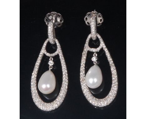 A pair of 18ct white gold, diamond and pearl ear pendants, each of pierced teardrop shape, having a centre pear shaped pearl,