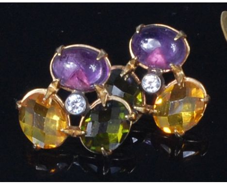 A pair of 18ct gold and semi-precious set ear studs, having cabochon amethyst, oval cut citrine, and tourmaline flanking a ce
