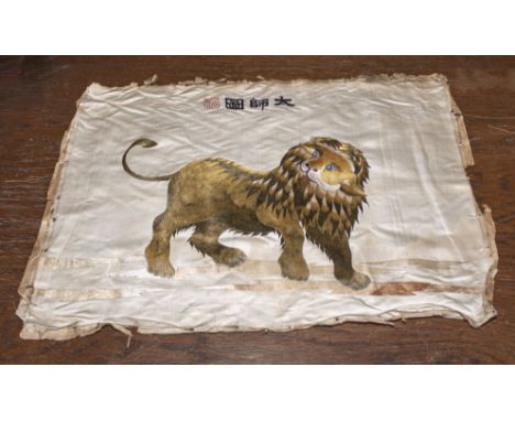 A Chinese antique silk embroidered picture of a lion, finely picked out in gold coloured silks, signed with a red seal mark. 