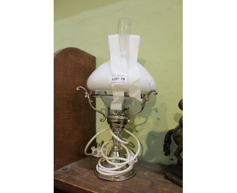 A chromed based table lamp with milk glass shade