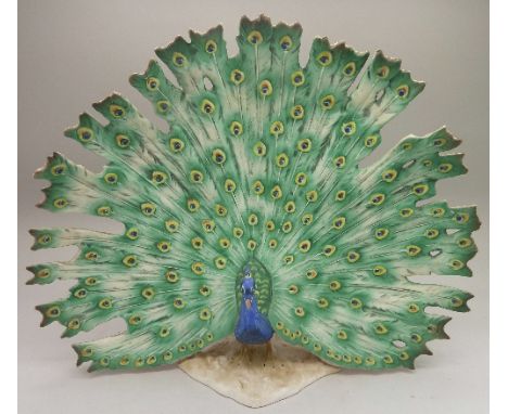 A Goebel model of a peacock, a/f, height 23cm