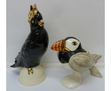 A Goebel puffin and parrot, puffin signed Selim, heights 27.5cm and 16.5cm, puffin paintwork a/f