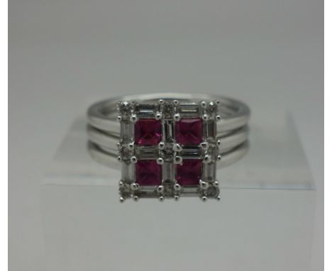 An 18ct white gold, Art Deco style baguette diamond and ruby ring, hallmarked London 2004, 0.75ct diamond weight and approxim