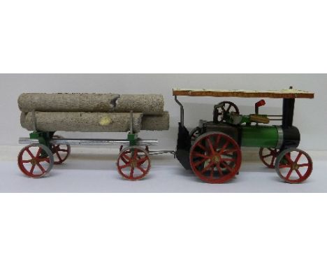 A Mamod steam traction engine with trailer and logs, TE1A