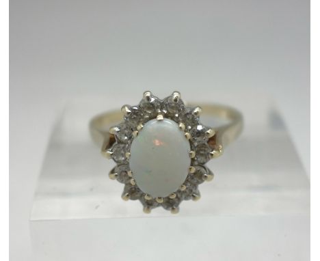 A 9ct gold, opal and white stone ring, weight 2.7g, size N