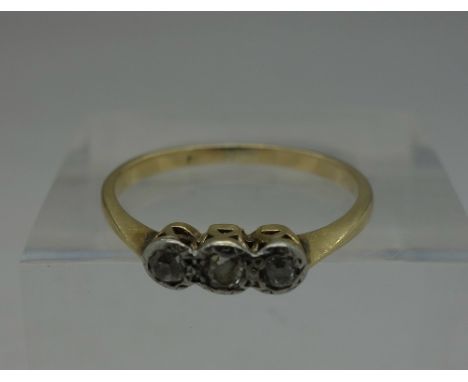 An early 20th Century yellow metal, platinum set three stone diamond ring, weight 2g, size M