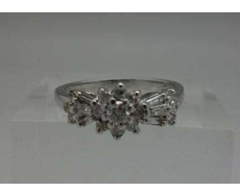 A 9ct white gold and diamond cluster ring, weight 3g, size M