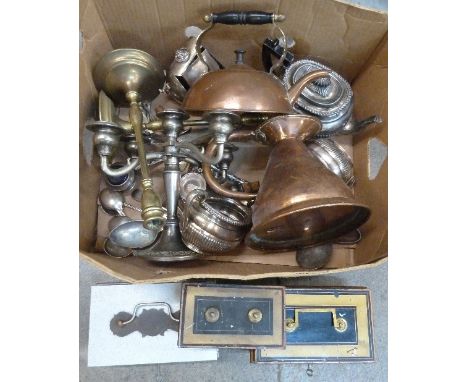 A three piece plated tea service, a pair of brass candlesticks, a copper jug, cash tins, a candelabra, etc.