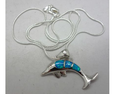 A silver and enamel dolphin pendant and chain