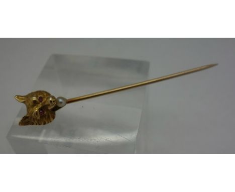 A 14ct gold and seed pearl fox's head stick pin, with ruby eyes, weight 2.2g