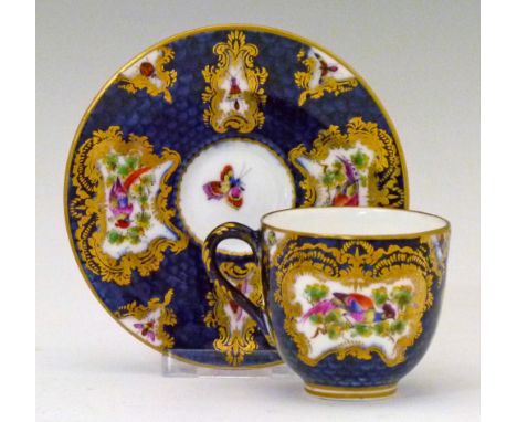 Royal Worcester cabinet cup and saucer decorated in the Chelsea style, gilt highlighted reserves with birds and butterflies o