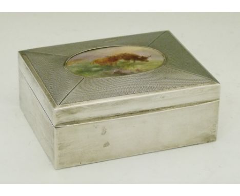 George V silver and Royal Worcester porcelain rectangular box, the engine turned hinged cover inset with a porcelain plaque b