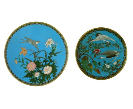 Two Japanese cloisonné dishes, Meiji period, each decorated with birds amongst foliage on a blue ground, 24.5cm and 30.5cm di