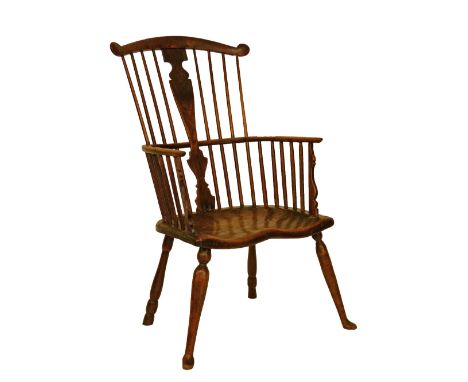 18th Century West Country elm, ash and oak comb back Windsor elbow chair having a vase shaped back splat, shaped seat and sta