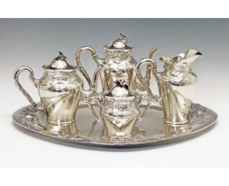 Late 19th/early 20th Century German silver four piece tea and coffee service by Bruckmann & Sohne, each piece having embossed