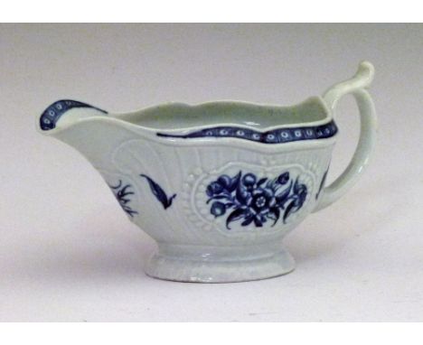 18th Century Worcester blue and white printed moulded sauce boat decorated with foliate sprays, 17cm long  Condition: No obvi