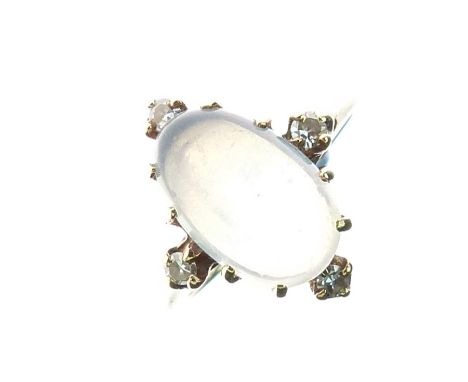 Moonstone and diamond ring, stamped '10k', the oval cabochon with single cut diamond at each of the compass points, size H, 2