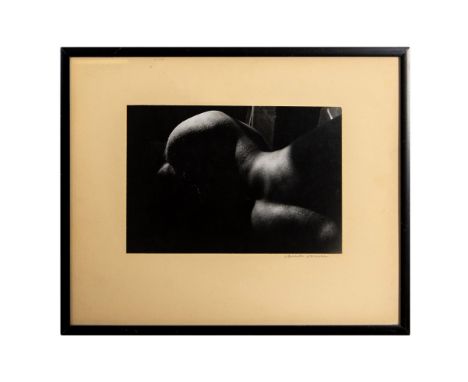 Black &amp; white photograph by Laurinda Stockwell of a reclining nude shot in natural soft evening light that highlights the