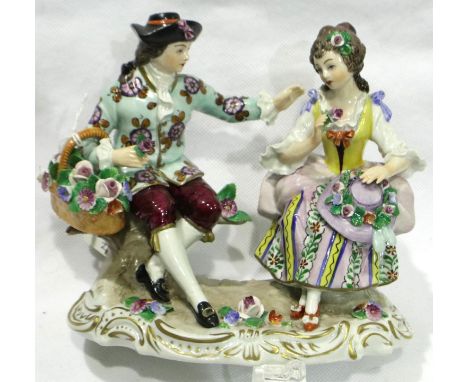 German Sitzendorf porcelain figurine of a couple sitting together with flowers, L: 16 cm, D: 10 cm, H: 14 cm, mark to base, n