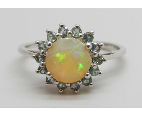 A 9ct white gold ring set with an Ethiopian opal and blue green stones, 2g, N/O