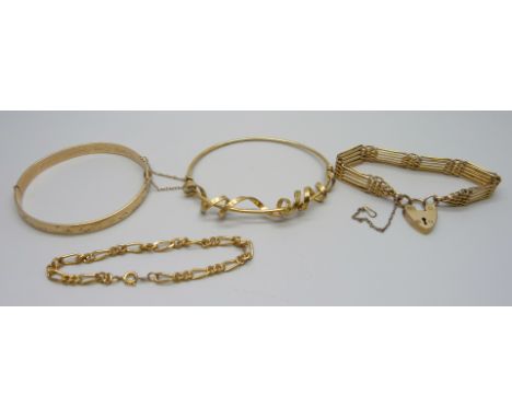 A 925 silver gilt bangle with ribbon detail, 14.5g, an 18ct rolled gold gate bracelet, a plated bangle and one other bracelet