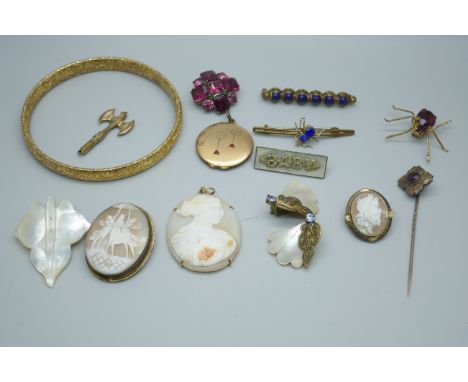 An Art Deco locket with two red stones, a bangle, a pin set with a red stone and other vintage jewellery
