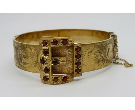 An antique gem set rolled gold bronze core buckle bangle 