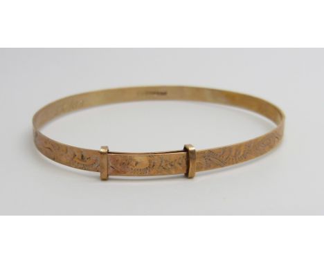 A small 9ct gold expanding bangle, 4g
