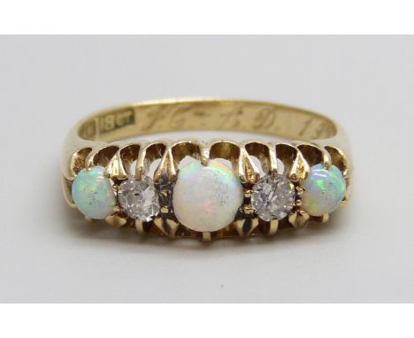 An 18ct gold, opal and diamond ring, 3.4g, N/O, boxed, one opal chipped