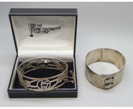Two silver bangles, the larger buckle bangle with inscription, a/f, 73g total
