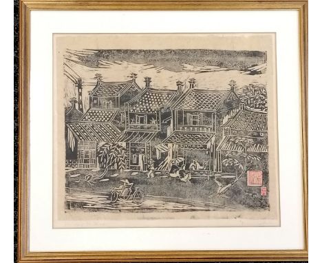 Framed woodblock print of a row of shops in Vietnam signed by Dinh Luc (b.1945) - 59cm x 53cm 