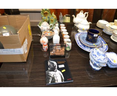 A collection of various oriental china to include teapots, terracotta warrior figures; coffee cans and saucers etc. 