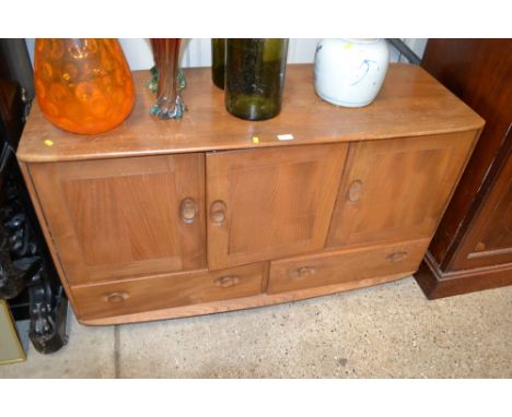 A light Ercol elm sideboard fitted two drawers 