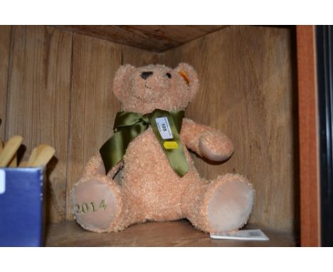 A Steiff Teddy bear with green ribbon 