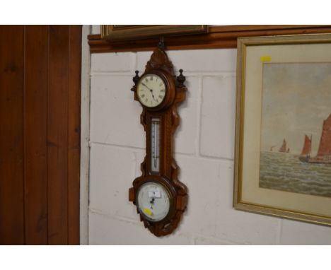 A walnut framed clock, barometer and thermometer 