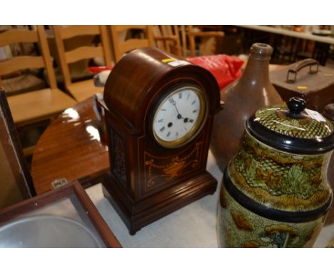 An early 20th century mahogany and inlaid mantel clock with twin train movement - key and pendulum on rostrum