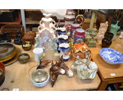 A china cased clock garniture set; together with a large floral encrusted coffee pot; a cottageware biscuit barrel; a pair of