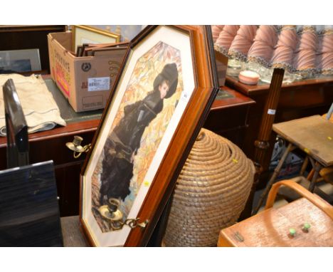 A large coloured print depicting a female figure, the framed mounted with candle sconces  