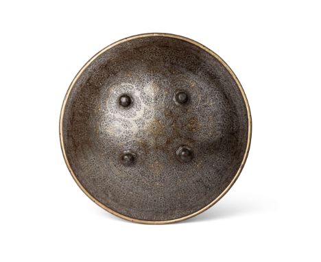  A QAJAR GOLD-DAMASCENED AND ENGRAVED STEEL SHIELD PERSIA, 19TH CENTURY of typical form with four raised circular bosses, the