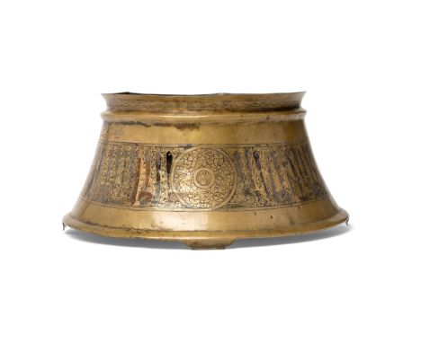  A MAMLUK ENGRAVED CANDLESTICK BASE EGYPT OR SYRIA, 14TH CENTURY of truncated conical form with flaring foot, a raised rib be