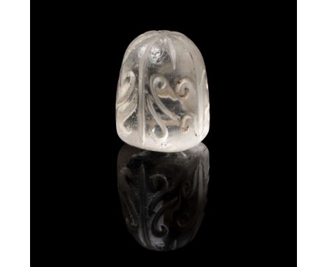  AN ABBASID OR FATIMID CARVED ROCK CRYSTAL CHESS PIECE EGYPT OR NEAR EAST, 9TH/ 10TH CENTURY of dome-shape on a flat base, wi