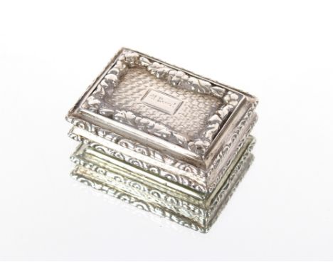 A Victorian silver vinaigrette, the cast lid with foliate borders and engine turned base, indistinct inscription to the carto