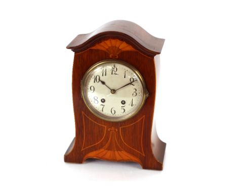 An Edwardian Art Nouveau design inlaid mantel clock having eight day movement striking on a gong, 31cm high&nbsp;