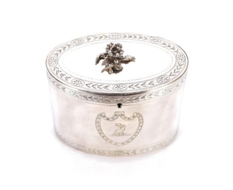 A George III silver oval tea caddy by Charles Aldridge, the hinged lid with foliate finial, floral band and wrigglework decor